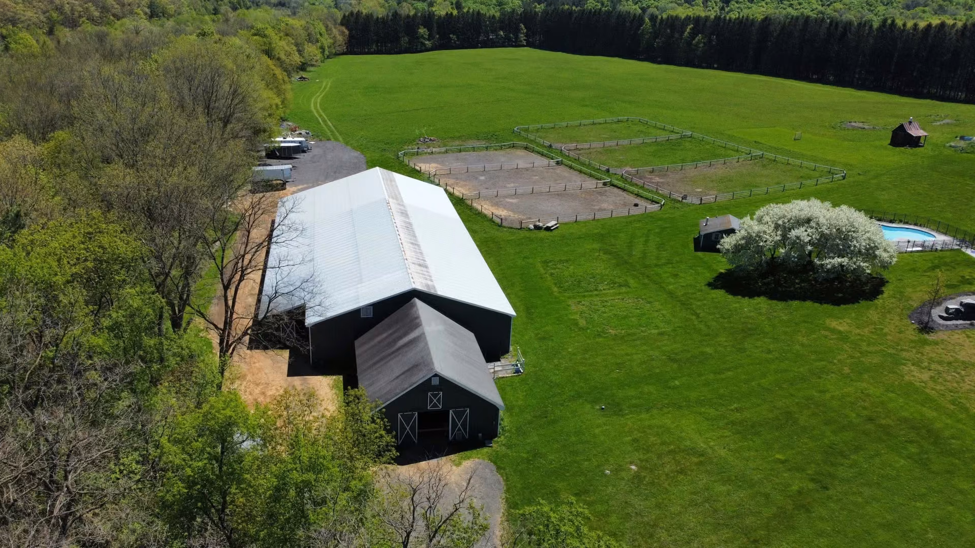Smokey Hollow Farm viewed from above, with its arenas, barns and paddocks